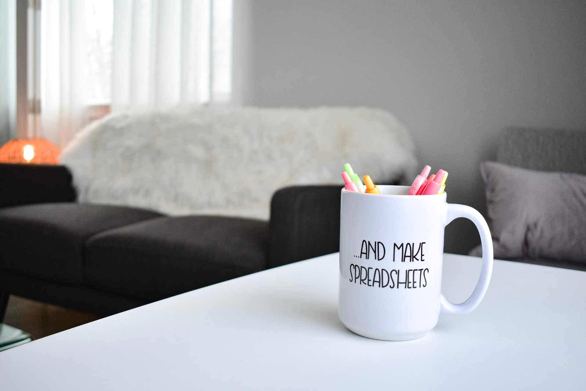 A Line & Ledger spreadsheets mug filled with colorful pens