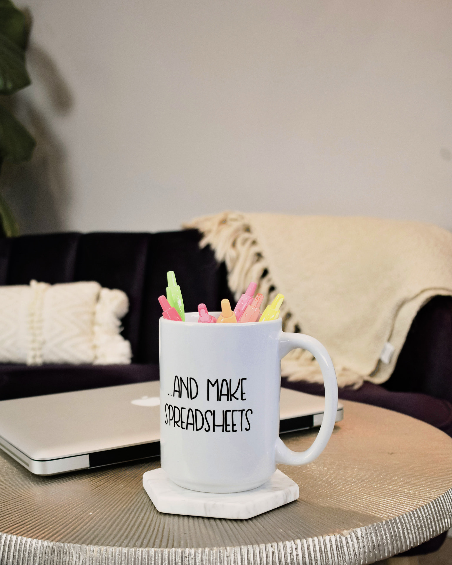 A laptop and a mug of highlighters on a desk at Line & Ledger